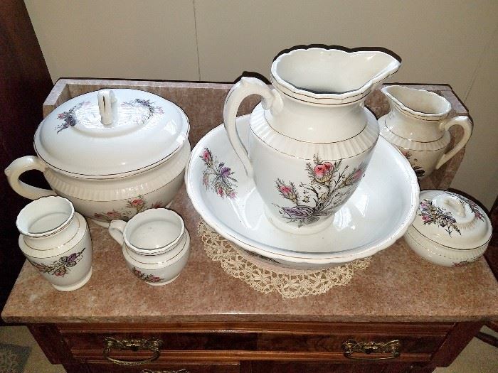 Antique wash pitcher and basin with matching pieces
