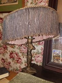 Antique brass woman figural lamp with beaded shade