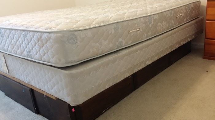 Queen wood bed frame with underbed drawer storage.