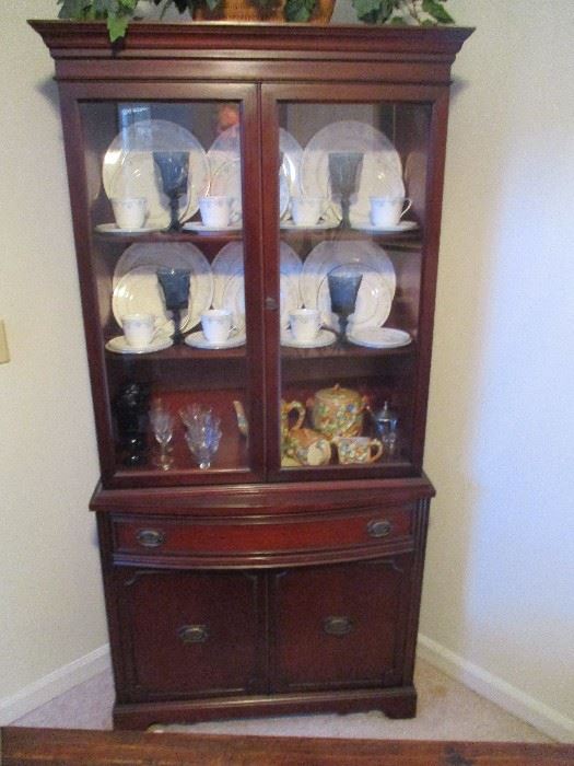 Vintage mahogany china cabinet, and all its contents.