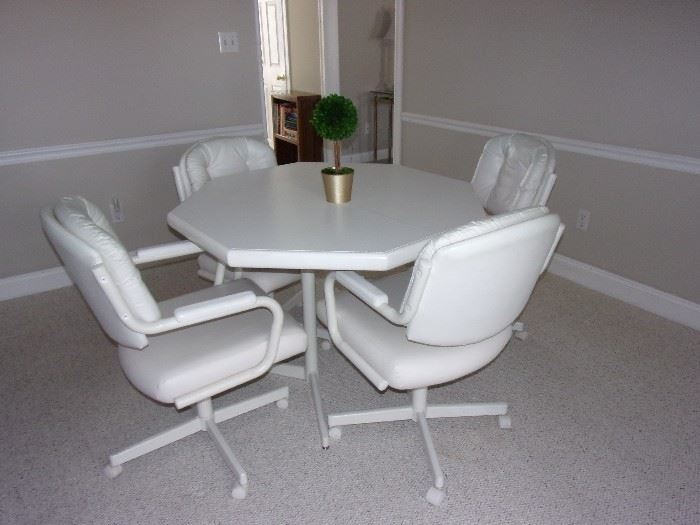 White kitchen table and chairs on casters