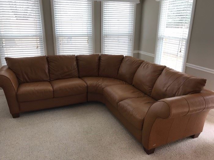 A brown leather sectional by Italsofa, a division of Natuzzi.  Beautiful brown leather upholstery. Part of the Milan Leather Collection.