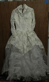 DRESS IS IVORY ADORNED WITH BUTTONS ON THE SLEEVE CUFFS & BACK OF THIS DRESS.NETTING HAS GATHERING ALL OVER FOR DETAIL, W/LACE. A MUST SEE PIECE!!! 
