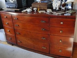 This bedroom suite includes a dresser with mirror, chest of drawers, bedframe, headboard, and 2 night stands