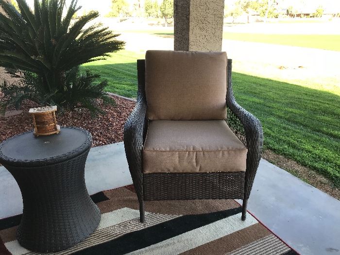 Two outdoor patio chairs loveseat , end table and coffee table.