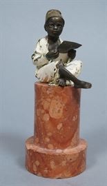 Lot 137 Vintage Bronze Figural Sculpture. African boy rea
