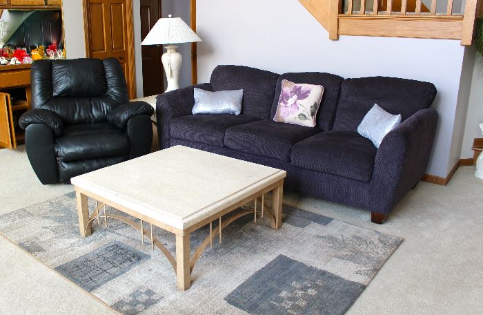 Sofa, rug, cocktail table, recliner, lamp and table.