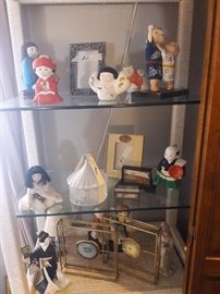 NICE COLLECTION OF ASIAN DOLLS ON A HENRY LINK CURIO ON CHEST