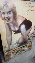 This is a very rare poster of June. It is about 5 ft by 39 inches. It is mounted on a wood frame with screws and the bottom has some damage, but with careful cleaning it will be great, it is now a great piece. THE GIRL THAT MADE PLAYBOY BLUSH.