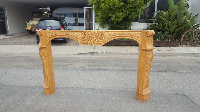 This is a never used hand carved mantel carved by George Mullen a Santa Barbara resident. The piece is about 90 inches wide and 54 tall , the opening or the inside is about 68 wide 47 highest and 41 lowest in the center . A book will be included about his work, it is a signed copy. There is a slight water staining around the bottom edge of the legs or sides. 