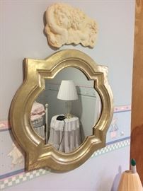 One of several framed mirrors