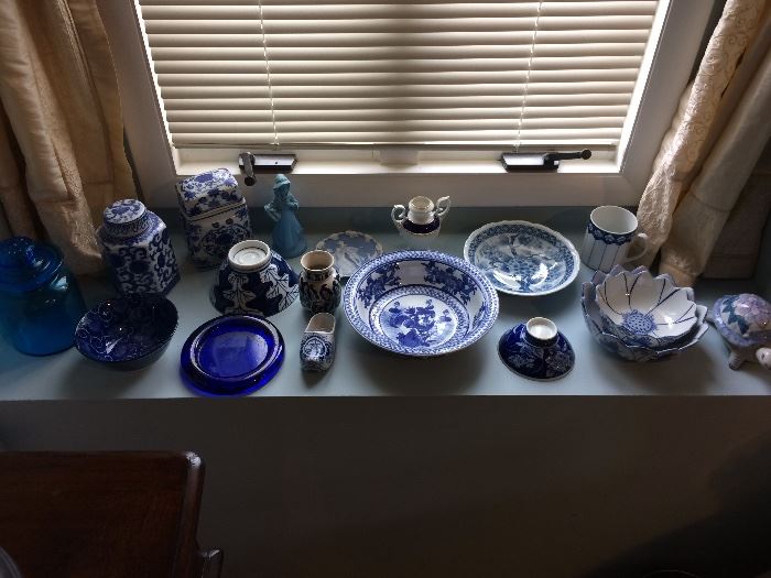 Collection of blue and white pottery and glass