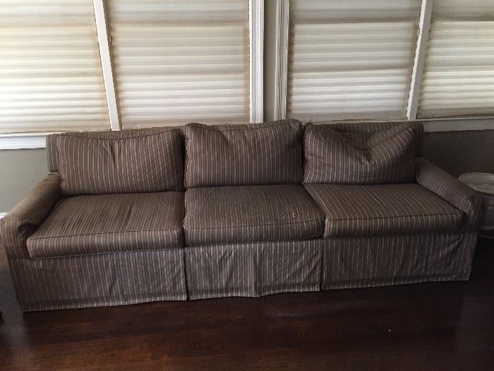 Long, three cushion, down stuffed, upholstered (silk blend) sofa.  