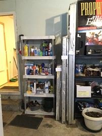 lots of household chemicals and supplies, aluminum ladders of all sizes, shelving