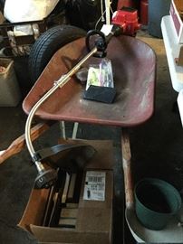 wheelbarrow and gas trimmer