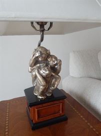 Living room table lamp with monkey detail.
