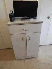 Kitchen cabinet,vintage metal. Small flat screen tv.