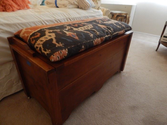Pine chest with cushion.