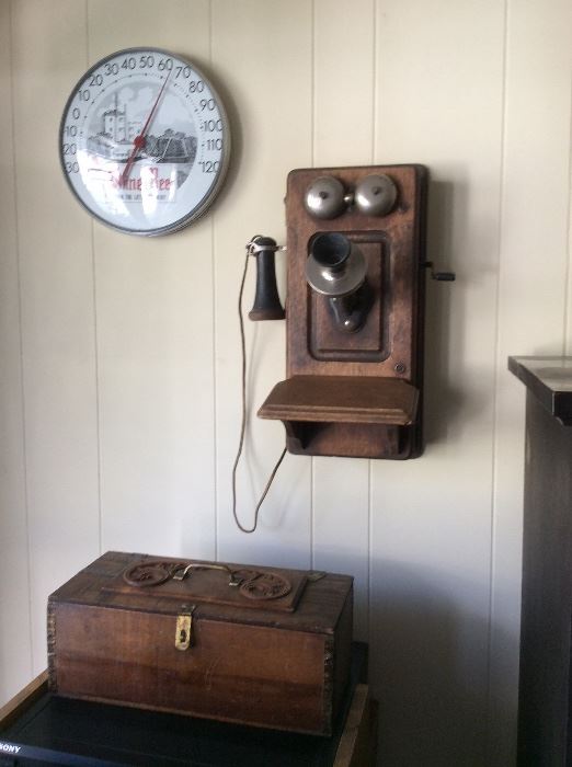 Advertising thermometer, old telephone, carved box