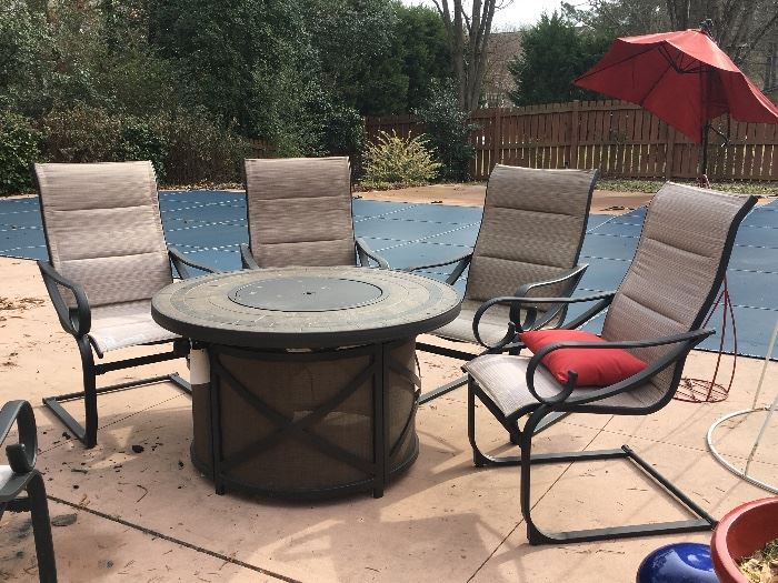 Gas fire pit in outdoor chairs