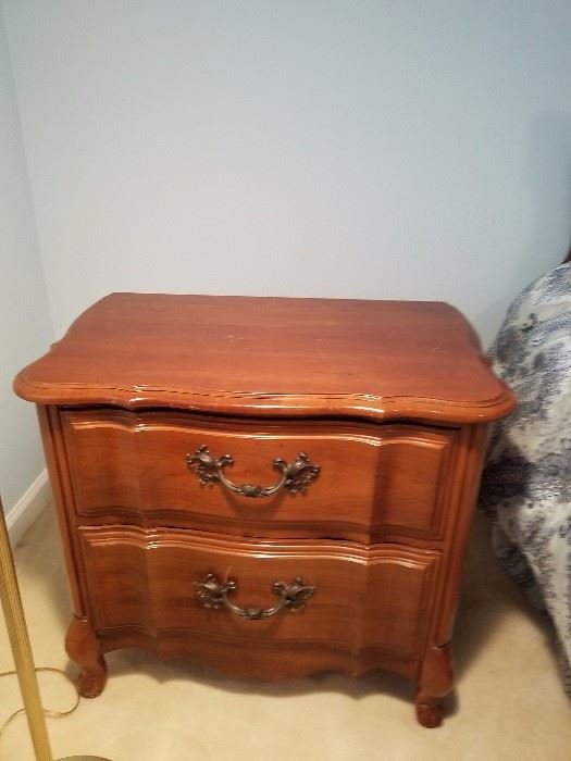 One of two matching bedside tables