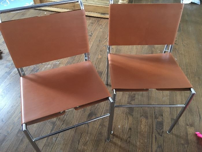 Leather and chrome chairs with laced accents by Classicon.