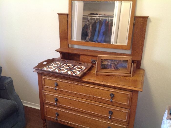 Antique dresser matches antique double bed.