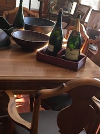 "Primitive " wood bowls, and a beautiful walnut table and six chairs