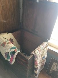 Antique linen cabinet with the collection of quilts