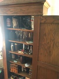 Beautiful oak armore great for barware as used here... electronics or bedroom 