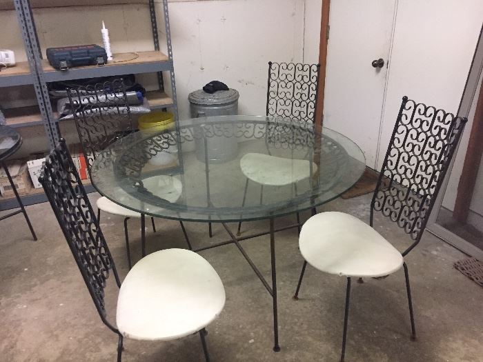 BUY IT NOW!Arthur Umanoff table & chairs 48" diameter top. Table shows some rust. Chairs are good.$800-