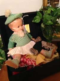 Doll, trunk, and clothes