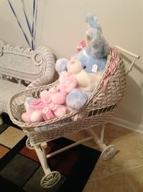 White wicker buggy and stuffed animals