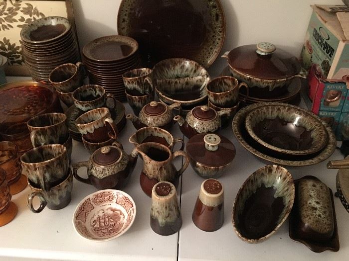 Brown drip pottery (Canonsburg?) Large setting, including platters, serving bowls, salt and pepper, covered putter, pitchers, sugar and creamers, covered dishes, cups saucers, plants, bowls, etc. 