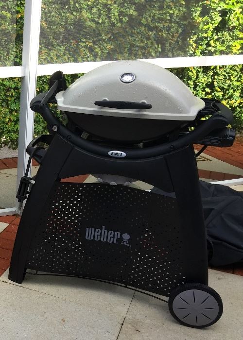 weber gas  grill with temperature gauge,  has cover, tank, stand, etc.   priced sep and  as one lot.