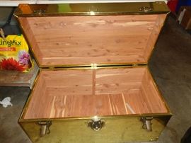 inside of brass trunk, has cedar