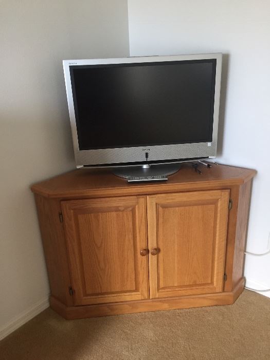 TV is sold!  Corner Cabinet is still available.