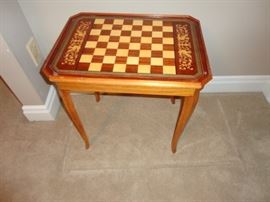 Reversible table top inlaid wood  other side is a floral scene 