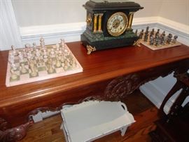Marble chess sets , Seth Thomas Clock on a Beautiful console table.