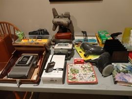 Many vintage cameras, accessories and film.