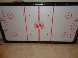 Air hockey game.