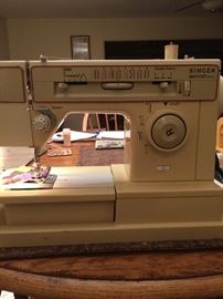 singer sewing machine.  Model 7105.  Has the manual.  I checked it out and it does sew.  Probably could use a cleaning before using .