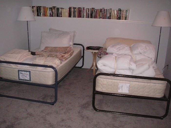 Twin beds; floor lamps, bedding