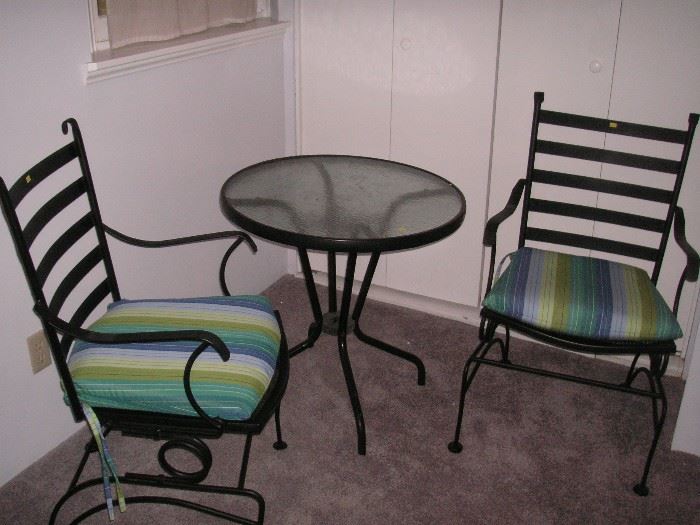 Nice wrought iron rocking chairs & table