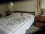 King electric adjustable bed with hand made bedspreads,