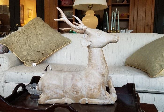 Larger carved deer, sleeper sofa, tray coffee table.