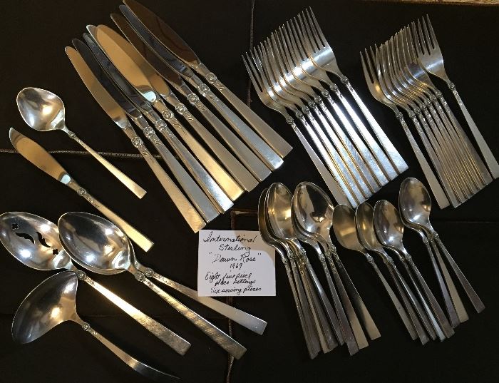 International Sterling eight five piece place settings plus six serving pieces.  Pattern is Dawn Rose, dated 1969.  Barely used.
