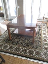 Thomasville dining table with two leaves and large area rug