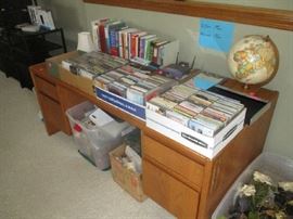 Large oak desk, books and CDs