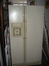 Side by side refrigerator with water and ice thru door.